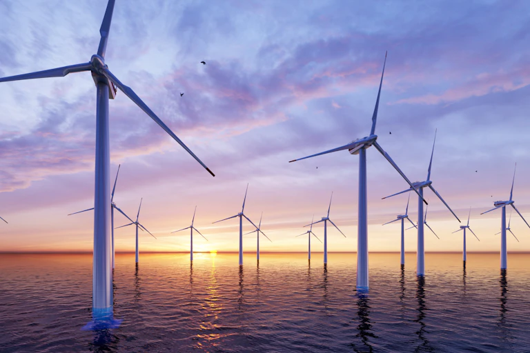 An offshore wind farm at dusk.