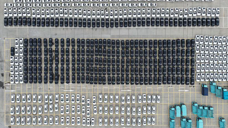 Aerial view of hundreds of electric vehicles.