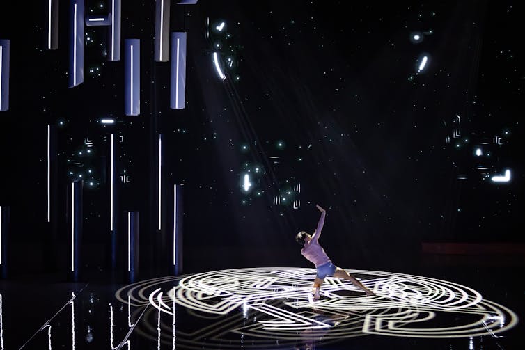 A man dances in concentric circles.