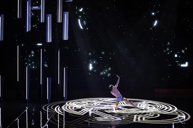 A man dances in concentric circles.