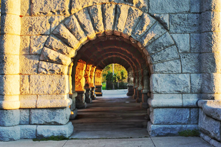 A round archway made of stone.