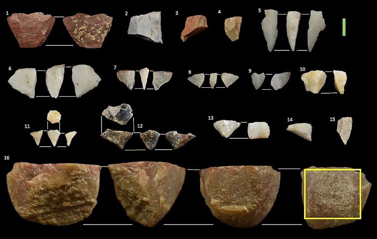 Pieces of stone laid out on a dark background