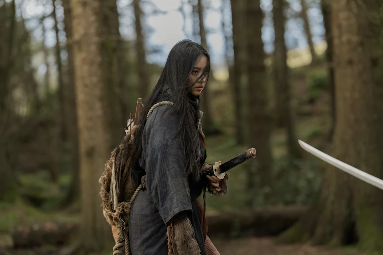 A young woman with a samurai sword