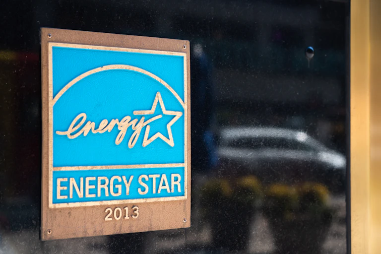 A sign on a building reads 'Energy Star' with the program's logo.