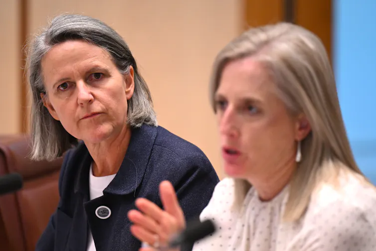 Jenny Wilkinson and Katy Gallagher sitting side by side during a committee hearing.