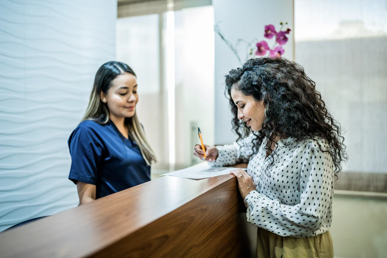 Woman fills in patient form