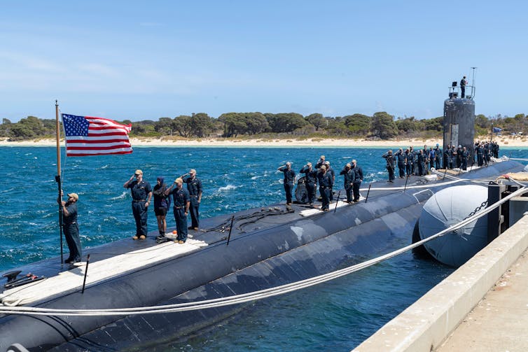 Troops on US streets in additional tactics than one whilst Trump considers axing Aukus defence pact 1 Sailors assigned to the Los Angeles-class fast-attack submarine USS Asheville (SSN 758) salute the national ensign after arriving at Royal Australian Navy HMAS Stirling Naval Base.