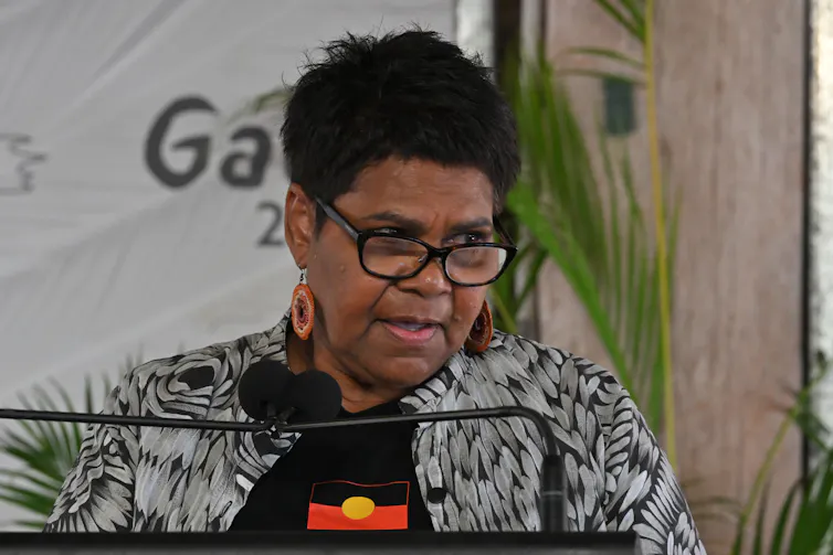 Marion Scrymgour speaking at a podium
