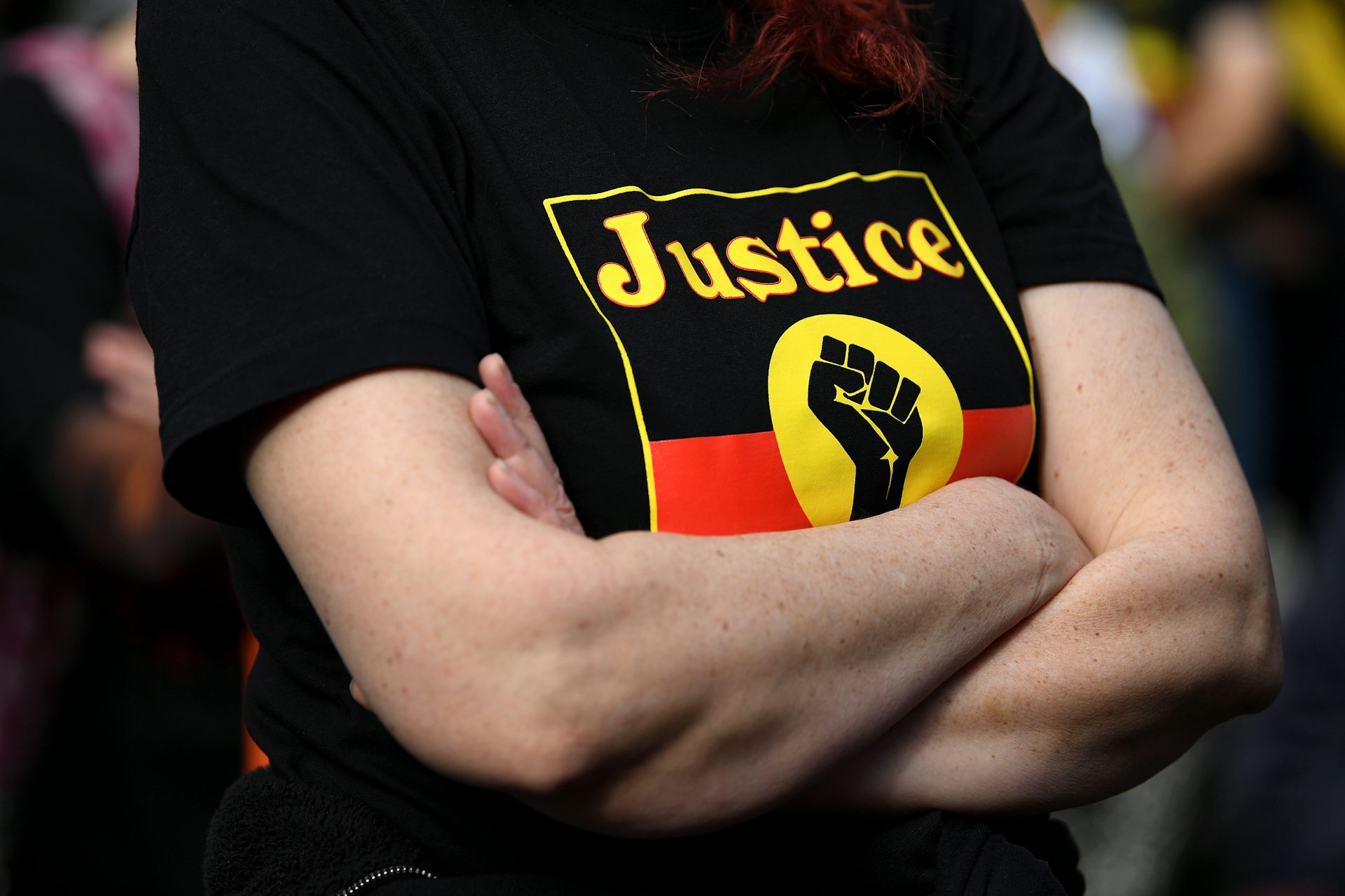A black, yellow and red t-shirt with the words 