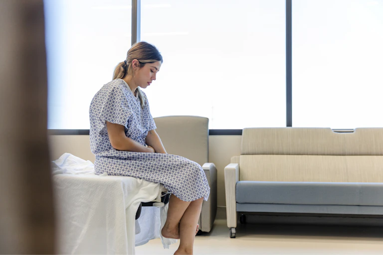 Woman waits for surgeon