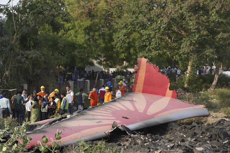 A large piece of a crashed aeroplane on the ground.