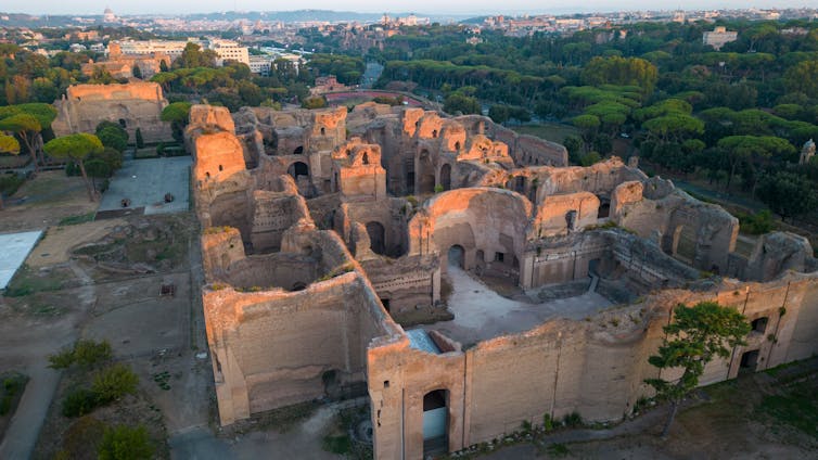 The baths of Caracalla mostly sit empty are shown from above.