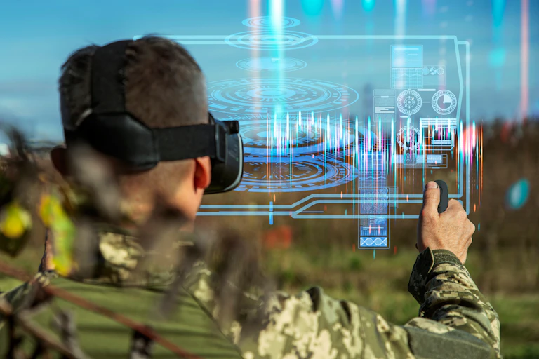 Photo illustration of a soldier wearing VR goggles and operating a screen in the air