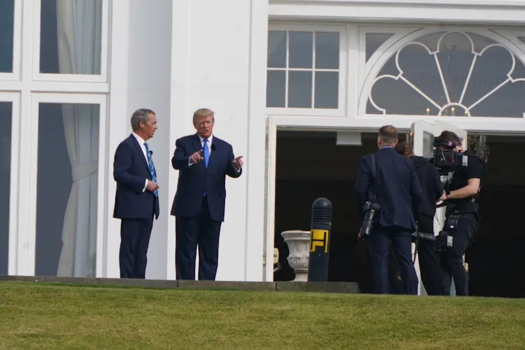 Nigel Farage and Donald Trump speaking outside a building.