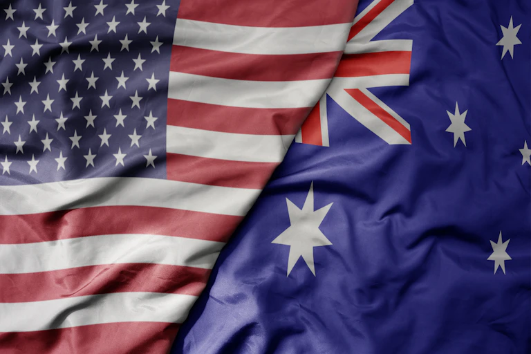 The Australian flag folded next to the Stars and Stripes.