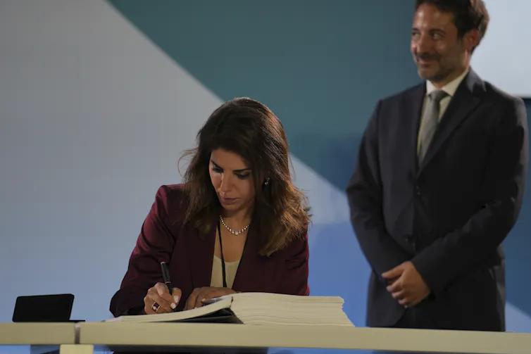 diplomat signs oceans treaty.