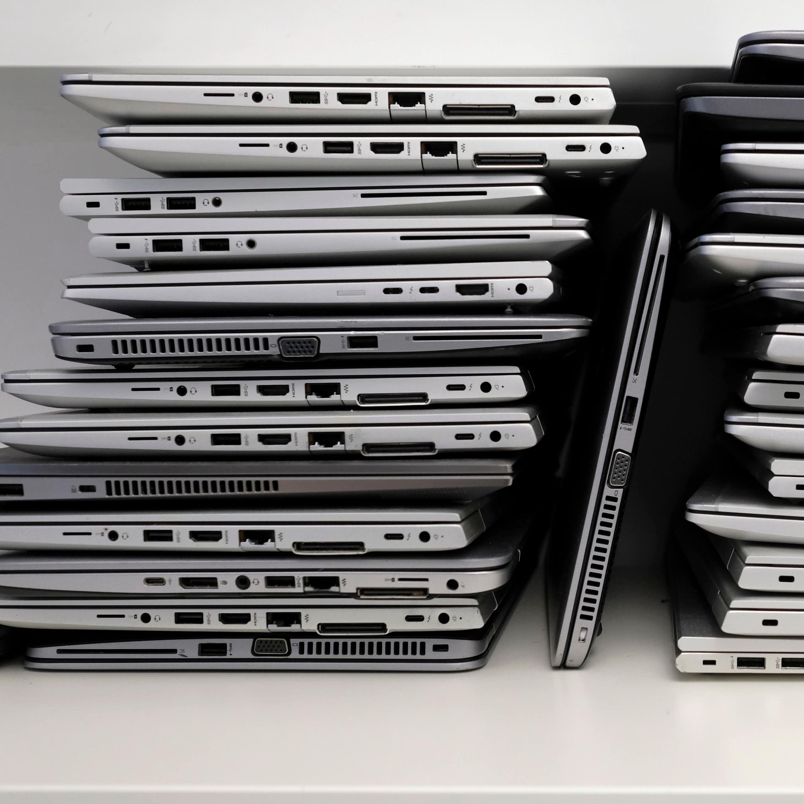 A rack with a stack of laptops.