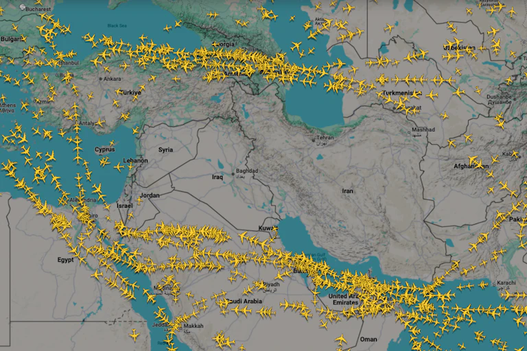 hundreds of plane icons on a flight tracking app map seen avoiding airspace between Iran and Israel