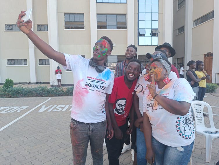 Man takes selfie with group of friends