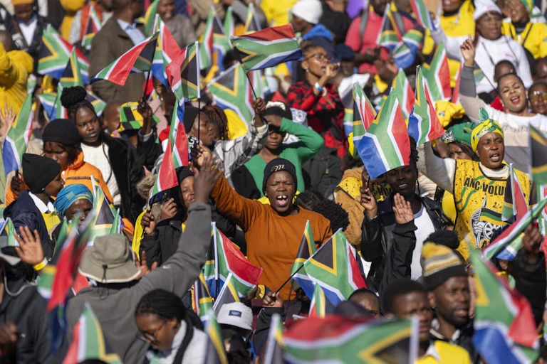 Group of people waving flags