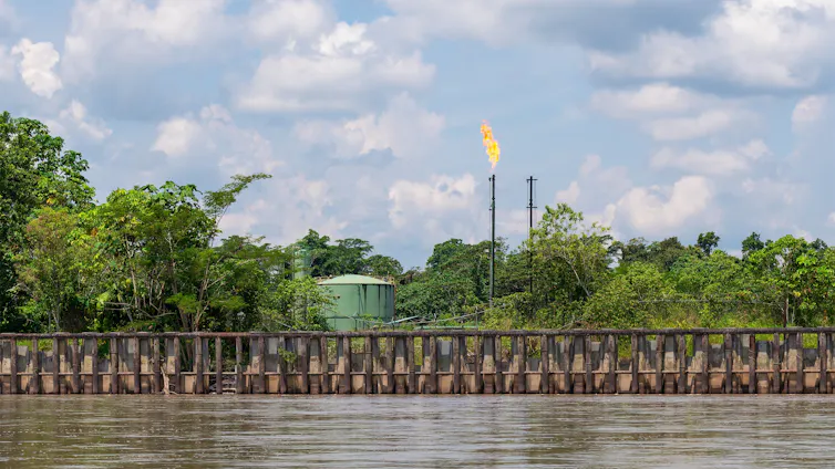 oil burning site on banks of Amazon river