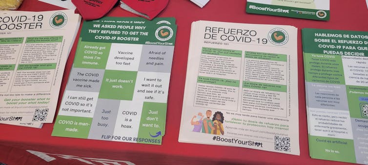 Green, white and gray educational material in small batteries on a table