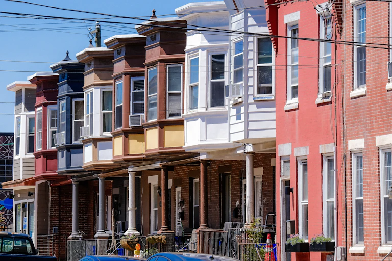 A block of colorful row homes