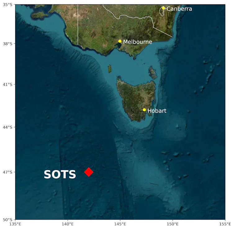 A satellite map with a red dot in the middle of the ocean, halfway between Tasmania and Antarctica.