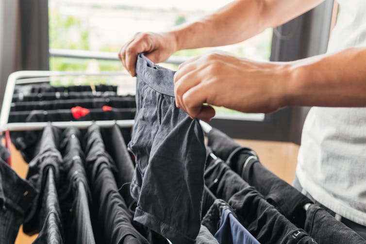 Man hangs undies on drying rack
