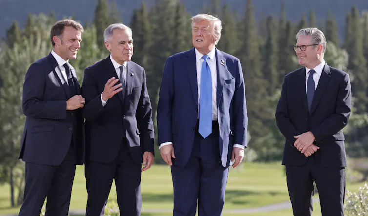 Macron, Carney, Trump and Starmer stood side by side.