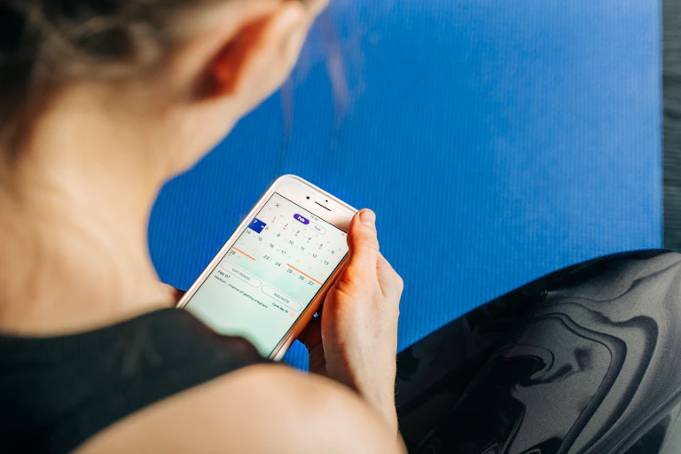 Looking over the shoulder of someone while they use a period-tracking app