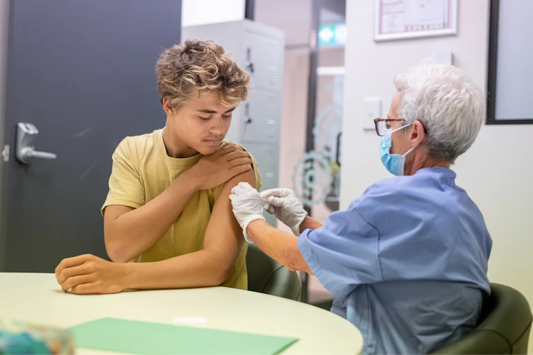 Boy gets vaccinated