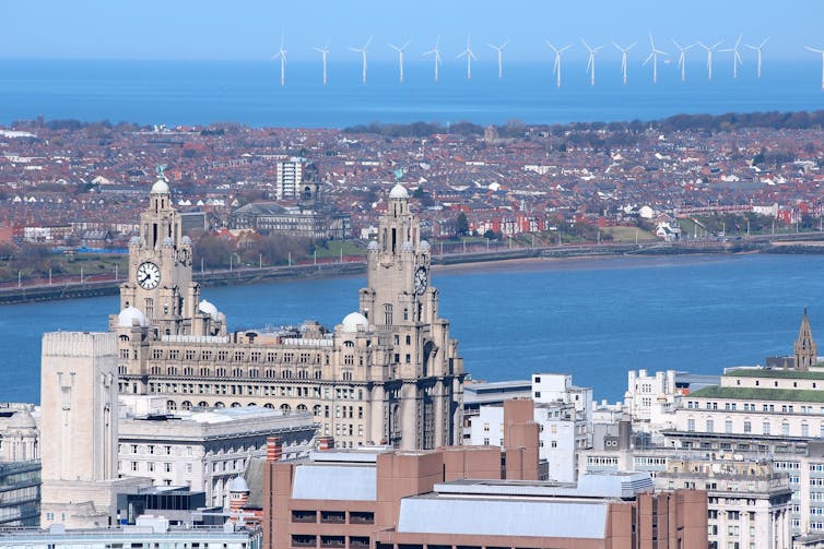 city buildings and offshore wind farm.