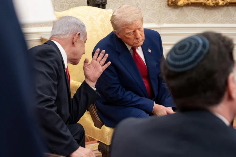 Donald Trump leans in to talk with Israeli prime minister Benjamin Netanyahu at the White House on April 7, 2025