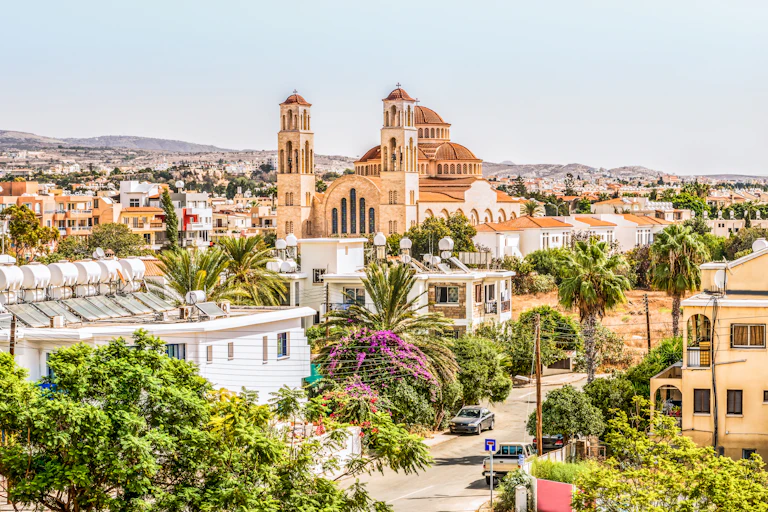photo of a Mediterranean city with a large cathedral in the middle