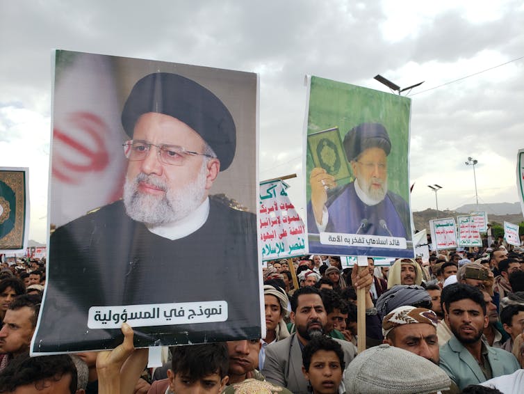 Trump’s first time period lies on the center of escalation between Iran and Israel 2 Protestors in Yemen holding a placard of Ebrahim Raisi.
