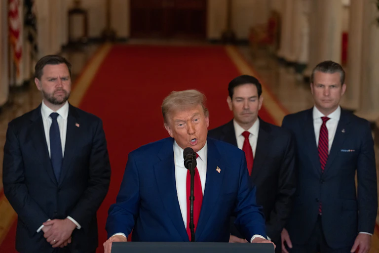 US president Donald Tru8mp stands at a podium in the White House flanked by vice-president J.D. Vance, secretary of state Marco Rubio and defense secretary Pete Hegseth