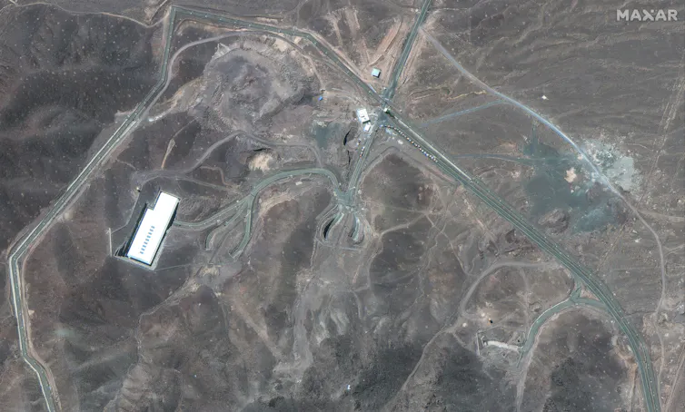 A satellite image shows roads and terrain.