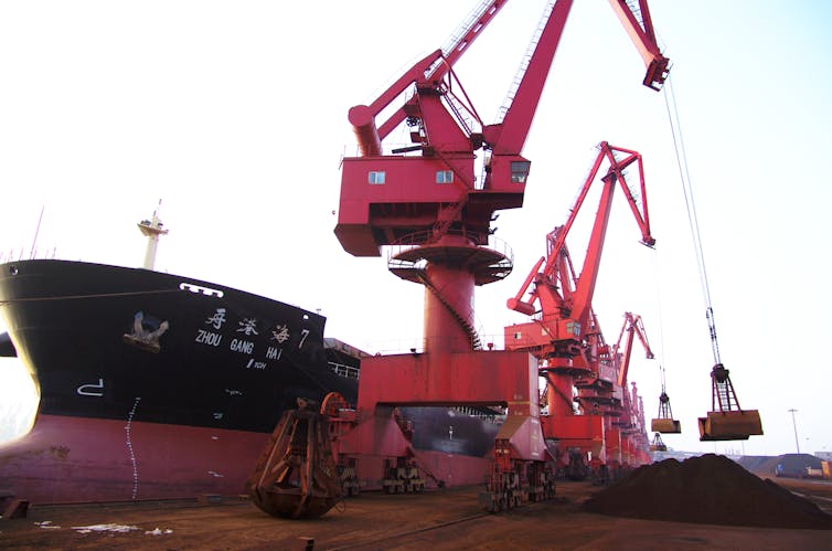 Iron ore being unloaded from a cargo ship.