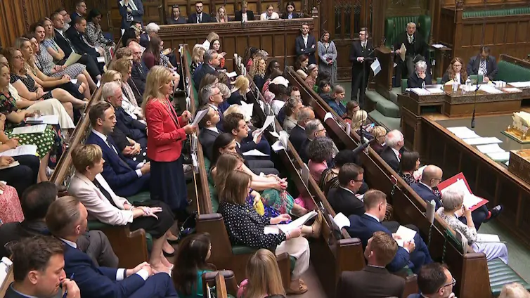 Kim Leadbeater standing up in a packed House of Commons.
