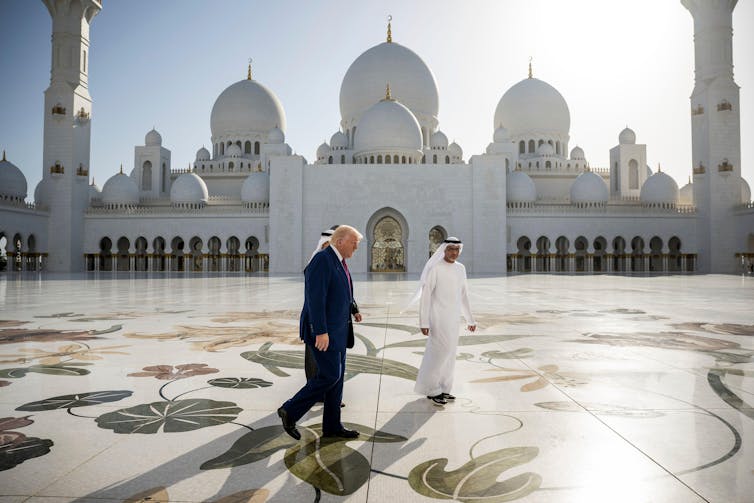 How would possibly the US-Iran warfare escalate? Knowledgeable Q&A 2 Donald Trump with Crown Prince Sheikh Khaled bin Mohamed walk past the Sheikh Zayed Grand Mosque in Abu Dhabi in May 2025.