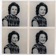A photo booth set of photos of a woman, serious and smiling, four images in series.