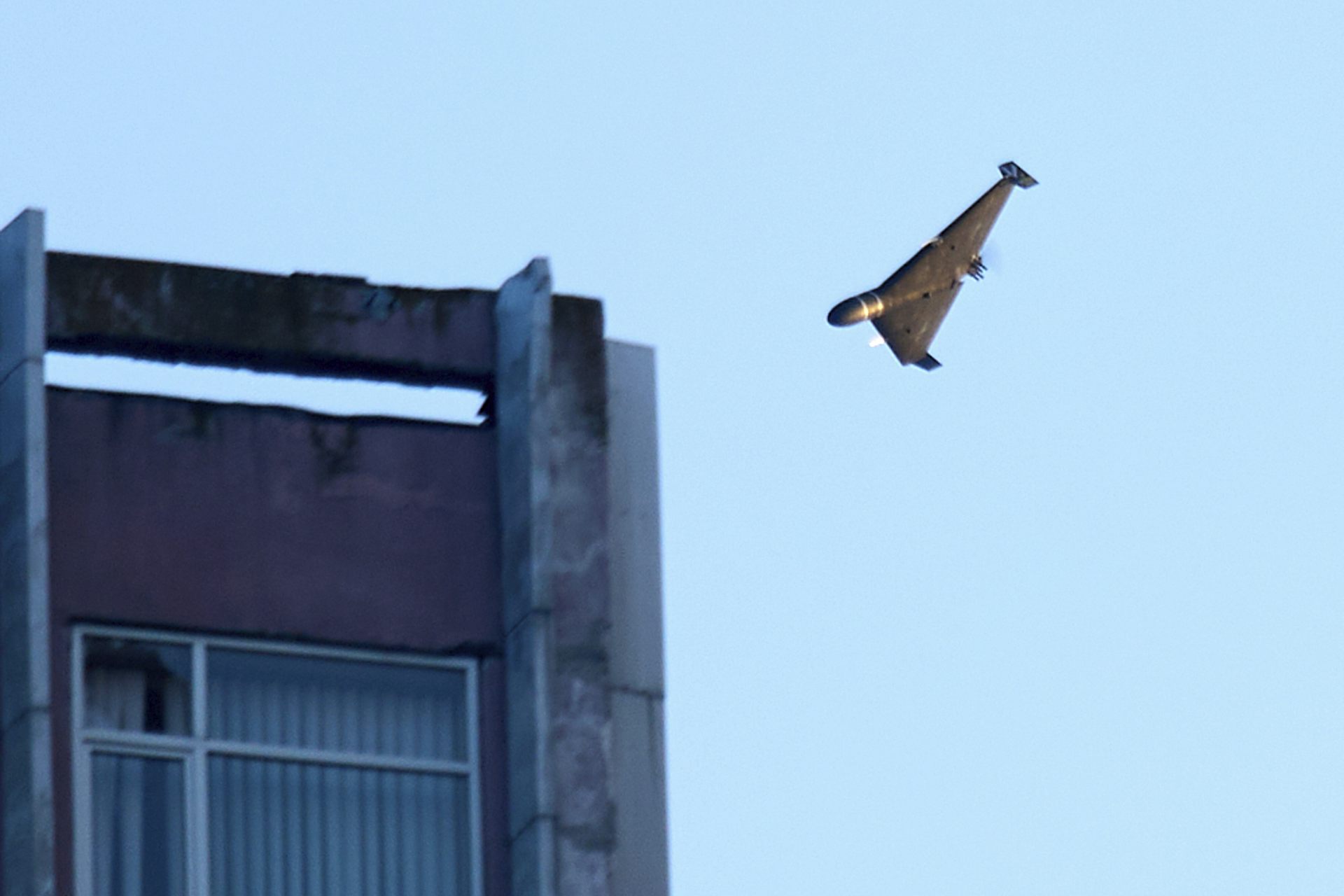Aerial view of a drone attacking a building