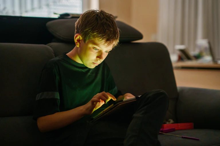 Teenage boy using a computer tablet