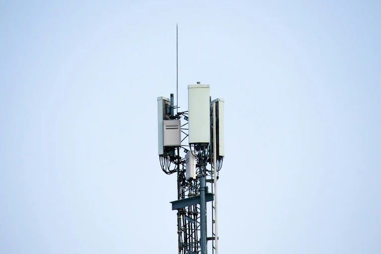 A mobile tower against a blue background.