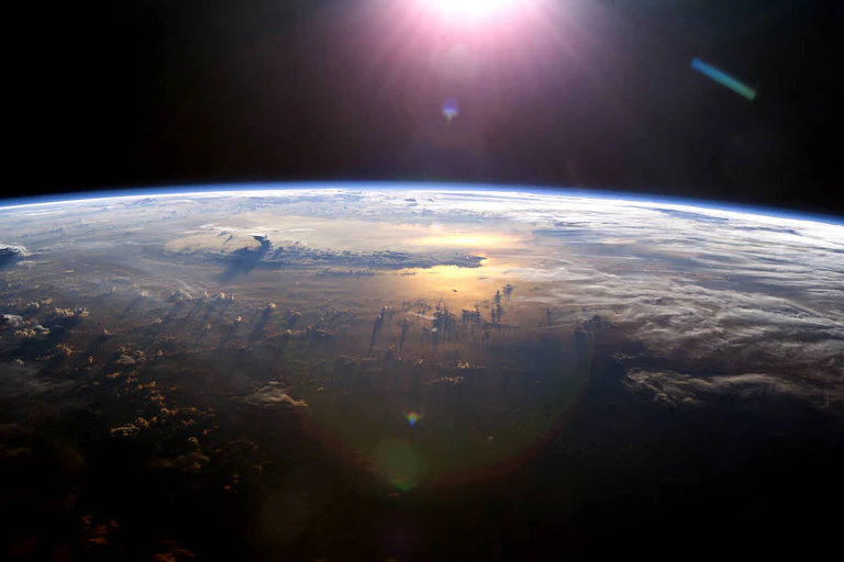 earth's atmosphere and sun.