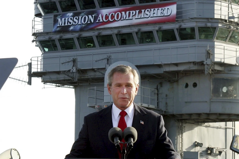President George W. Bush speaks aboard the aircraft carrier USS Abraham Lincoln off the California coast on May 1, 2003.
