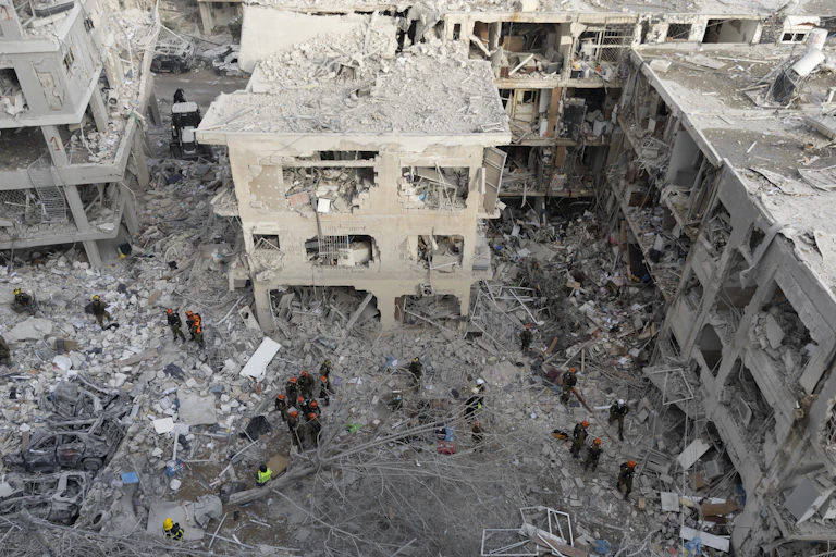 Emergency and rescue soldiers search for trapped people around heavily damaged buildings in Bat Yam, Israel, after an overnight missile strike from Iran on June 15, 2025.