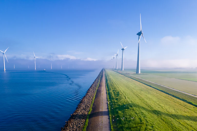 wind farm next to the sea in flevoland, netherlands.