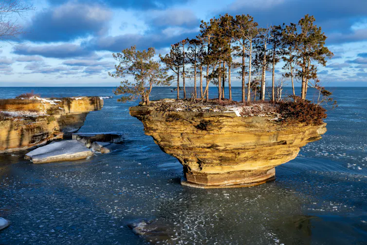 Morning sun lights up a rock formation on Lake Huron.
